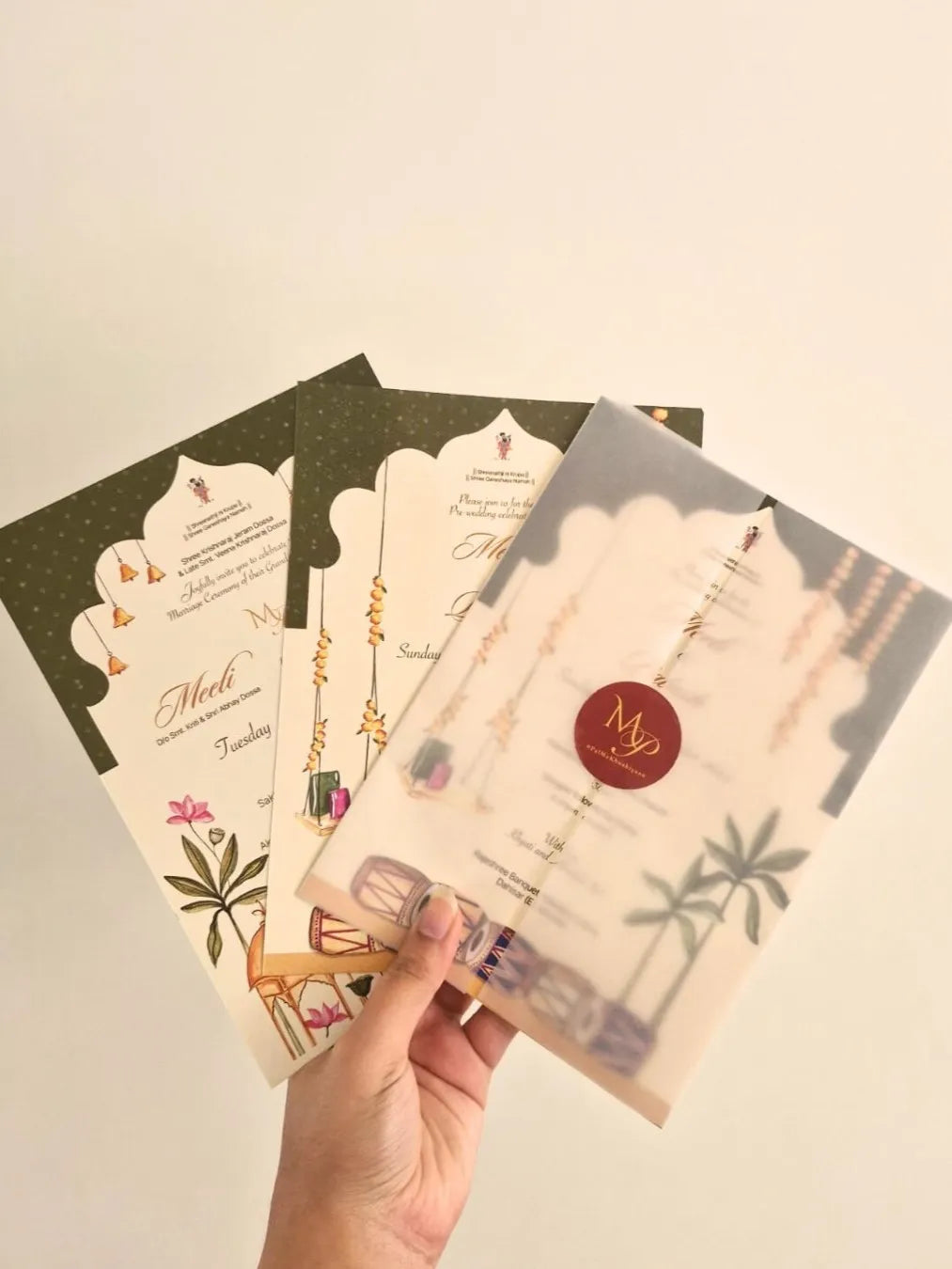 Hand-illustrated Wedding invitation with Indian motifs and elements.